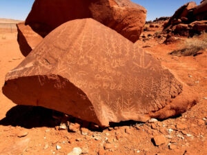 Petroglyph covered boulder.